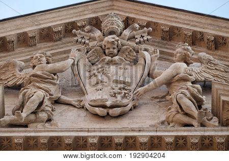 ROME, ITALY - SEPTEMBER 01: Coat of arms of Pope Alexander VII Chigi on the portal of Sant Andrea della Valle Church in Rome, Italy on September 01, 2016.