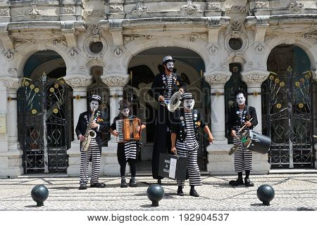 AVEIRO PORTUGAL - JUNE 10 2017: Street musicians perform a show on the street in Aveiro. Aveiro is one of the most popular tourist cities in Portugal