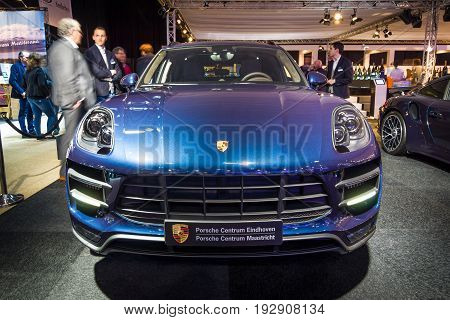 MAASTRICHT NETHERLANDS - JANUARY 14 2016: Compact luxury crossover Porsche Macan Turbo. International Exhibition InterClassics & Topmobiel 2016