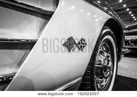 MAASTRICHT NETHERLANDS - JANUARY 14 2016: Detail of a sports car Chevrolet Corvette (C1) 1960. Black and white. International Exhibition InterClassics & Topmobiel 2016