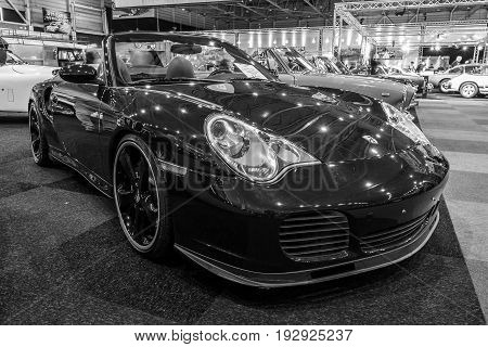 MAASTRICHT NETHERLANDS - JANUARY 14 2016: Sports car Porsche 996 Turbo 2003. Black and white. International Exhibition InterClassics & Topmobiel 2016