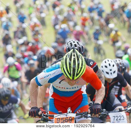 STOCKHOLM SWEDEN - JUNE 11 2017: Closeup of elite mountain bike cyclist competitors behind at Lida Loop Mountain bike Race. June 11 2017 in Stockholm Sweden