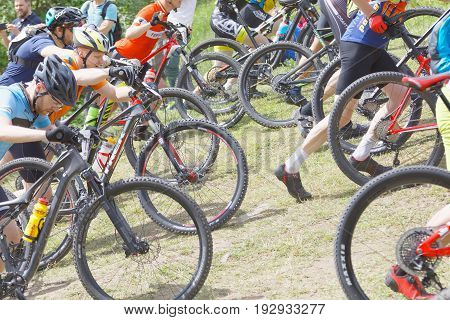 STOCKHOLM SWEDEN - JUNE 11 2017: Group of fighting male mountain bike cyclists leading cycle uphill at Lida Loop Mountain bike Race. June 11 2017 in Stockholm Sweden