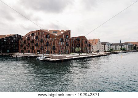 Copenhagen Denmark - August 12 2016: Waterfront of Copenhagen with modern residential buildings
