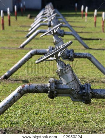 Shut-off Valves In An Industrial Refinery For The Storage Of Met