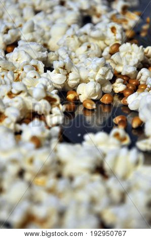 Popcorn and corn spread-ed over the Floor