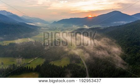 Aerial view of sunrise over a valley. Natural park Zelenci, Slovenia.