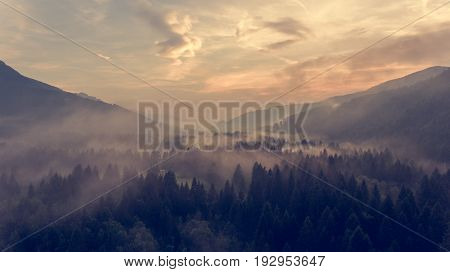 Aerial view of sunrise over a valley. Natural park Zelenci, Slovenia.