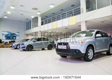 Russia Kirov - December 06 2016: Showroom of dealership Chevroled named Souz and car in it in Kirov city in 2016