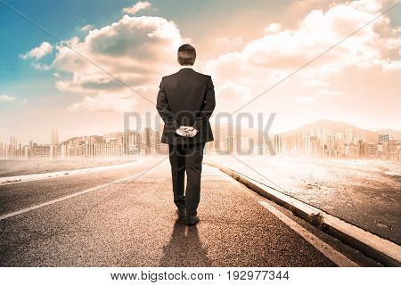 business walking far from a desert city