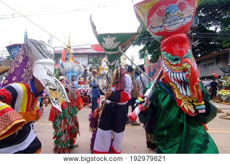 LOEI THAILAND - JUNE 25 2017 : Phi Ta Khon is a type of masked procession celebrated on the first day of a three-day Buddhist merit-making holiday known in Thai as Boon Pra Wate