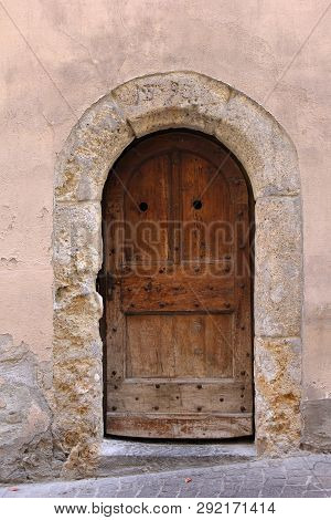 Old Door With Eroded Stone Arch In The City Sion, Switzerland