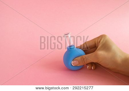 Female Hand With French Manicure Squeezes Medical Cosmetic Jar For Vacuum Massage Of Body And Face, 