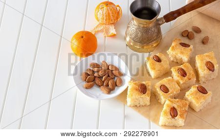 Pieces Basbousa (namoora) Traditional Arabic Semolina Cake With Almond Nut And Syrup, Orange And Coo