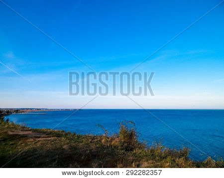 Baltic Sea From Cliff In Mechelinki, Poland. Nature And Travel Concept. Copy Space On Blue Sky.