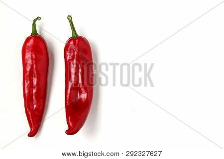 Red Sweet Pepper Is Located On A White Background, Copy Space