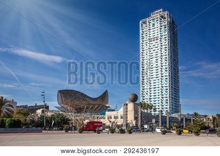 Barcelona, Spain December 15, 2018: Hotel Arts And Peix Sculpture In Port Olimpic On August 12, 2011