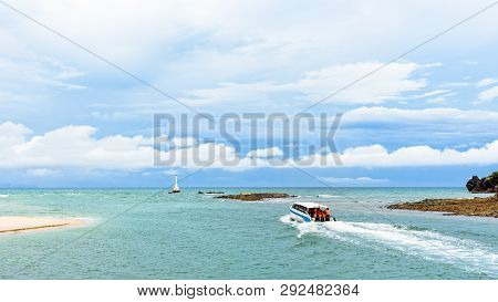 Speed Boat Passenger With Tourists On The Sea Is Leaving The Coast Of Tarutao Island, Beautiful Natu