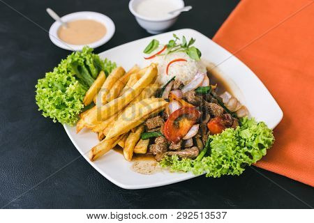Lomo Saltado With Peruvian Sauce And Garlic Sauce