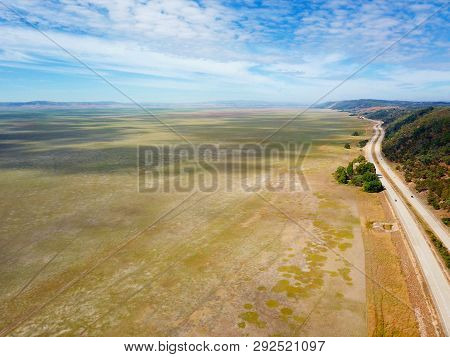 Empty Lake George Nestled Between Farmland And Federal Highway In Australia. Lake George Is An Endor