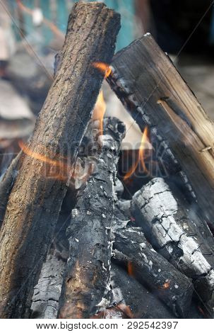 Fire. Closeup Of Pile Of Wood Burning With Flames In The Fireplace.