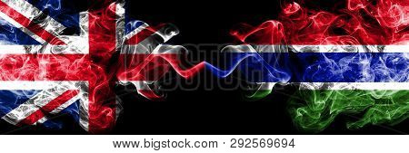 United Kingdom Vs Gambia, Gambian Smoky Mystic Flags Placed Side By Side. Thick Colored Silky Smoke 