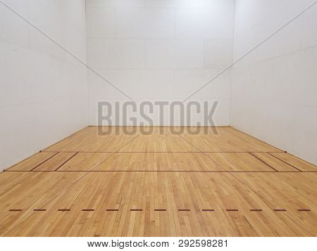 Wood Floor Racquetball Court With White Walls