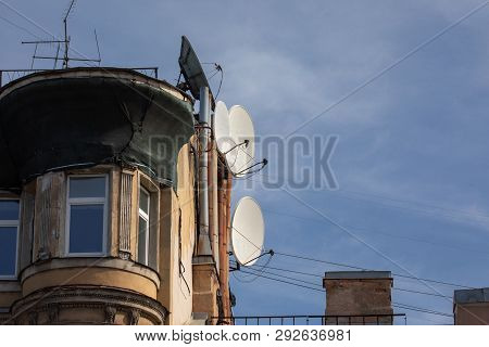 Fragment Of A Brick House With Satellite Antennas
