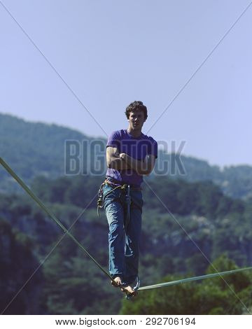 Man Balancing On The Rope Concept Of Risk Taking And Challenge.