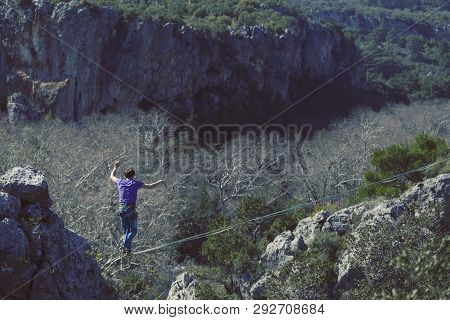 Man Balancing On The Rope Concept Of Risk Taking And Challenge.