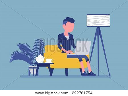 Young Male Employee Working From Home. Happy Freelance Worker, Self-employed In Comfortable Remote L