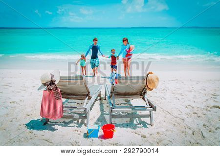 Mom, Dad With Kids Have Fun On Beach Vacation, Family At Sea