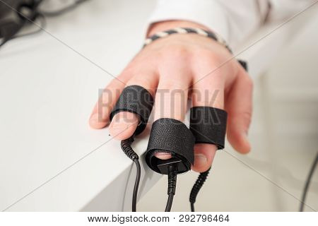 Mans Hands On Which Polygraph Sensors Are Worn.