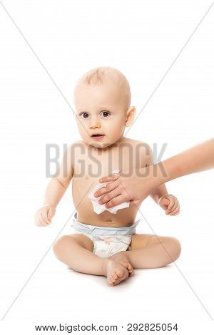 Hygiene - Young Momy Wiping The Baby Skin With Wet Wipes Isolated On A White Background.