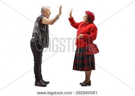 Full length shot of a grandmother and elderly punker gesturing high-five isolated on white background
