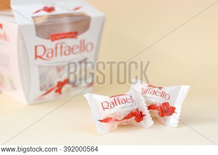 Raffaello Candies On Beige Background. Raffaello Is A Spherical Coconut Almond Confection That Itali