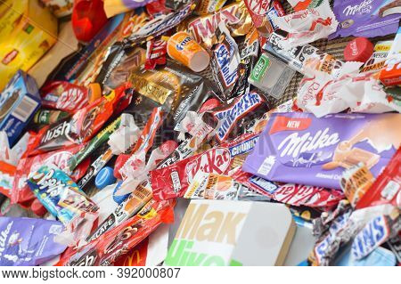 Many Wrappings And Cans From Used Products By Famous Worldwide Brands. Pattern Of Trash Of Various C