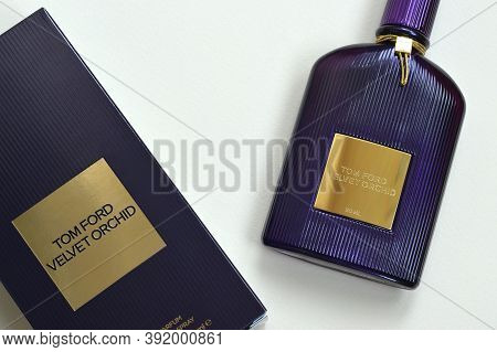 Tom Ford Velvet Orchid Fragrance Perfume Bottle Lies On Light Lilac Background. Tom Ford Is American