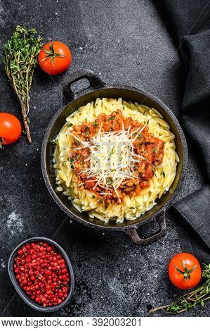 Bolognese Pasta, Risone With Ground Beef In A Plate. Black Background. Top View