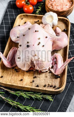 Concept Of Cooking Whole Poult. Ingredients Rosemary, Pink Salt, Garlic And Cherry Tomatoes. Gray Ba
