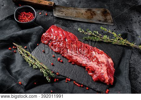 Raw Marbled Beef Steak With Pink Pepper And Thyme. Black Background. Top View