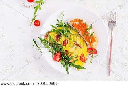 Omelette With Tomatoes, Cheese, Ham And Sandwich Wich Red Cavier On Plate.  Frittata - Italian Omele
