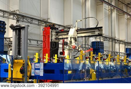 Robotic Welding Complex In The Production Workshop Of An Industrial Plant. Complex Production Line, 