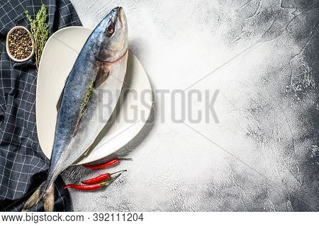 One Piece Of Japanese Amberjack. Raw Fish Yellowtail. Gray Background. Top View. Copy Space