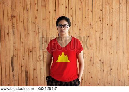 Woman Wearing Democratic Kampuchea Flag Color Shirt And Standing With Two Hands In Pant Pockets On T