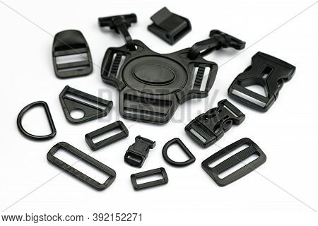A Set Of Black Plastic Accessories For The Manufacture Of Backpacks And Bags. Fivepin Fastex, Plasti