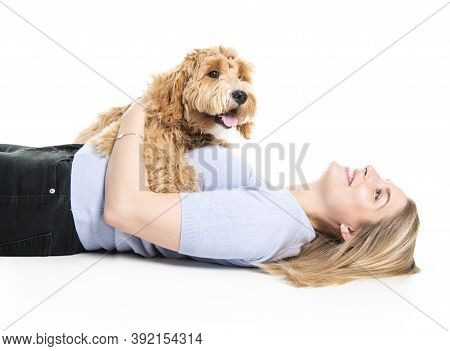 Woman With His Golden Labradoodle Dog Isolated On White Background