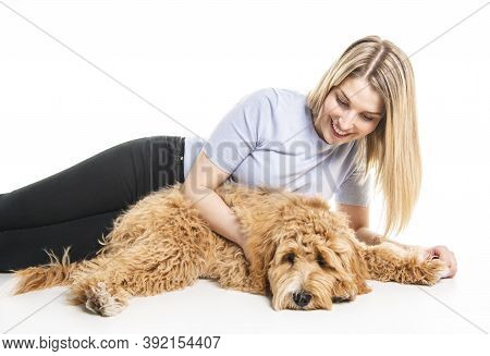 Woman With His Golden Labradoodle Dog Isolated On White Background