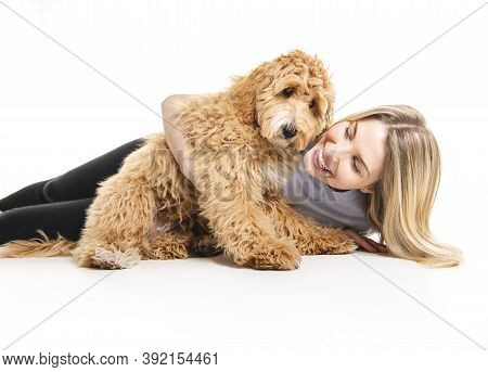 Woman With His Golden Labradoodle Dog Isolated On White Background