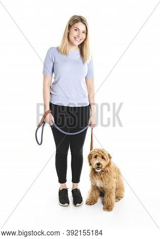 Woman With His Golden Labradoodle Dog Isolated On White Background